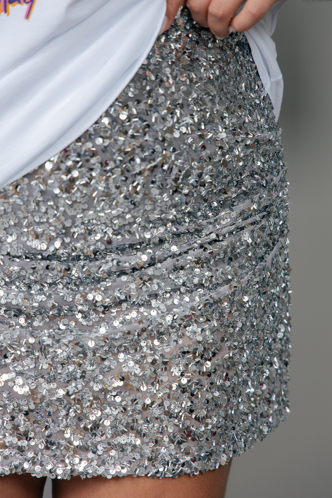 SHORT SAIA COM FRANZIDO DE PAETÊ PRATA SHORT SAIA COM FRANZIDO DE PAETÊ PRATA