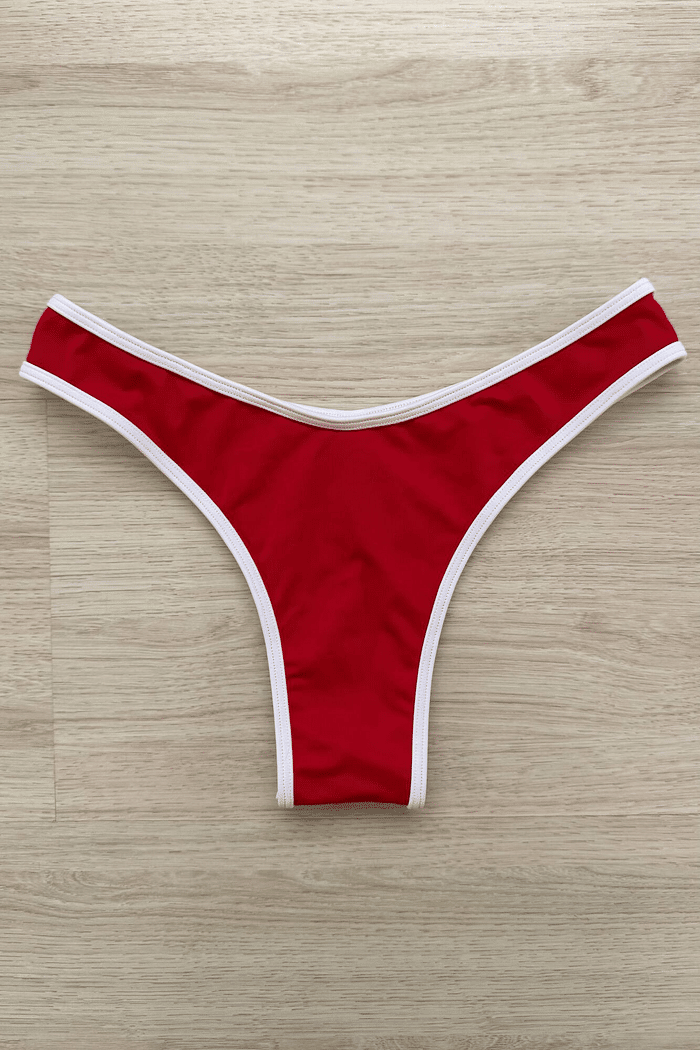 Calcinha de biquíni Maya Duna VIBE BIKINIS estilo fio dental, cor vermelha em tecido duna com viés branco, vista de cima.